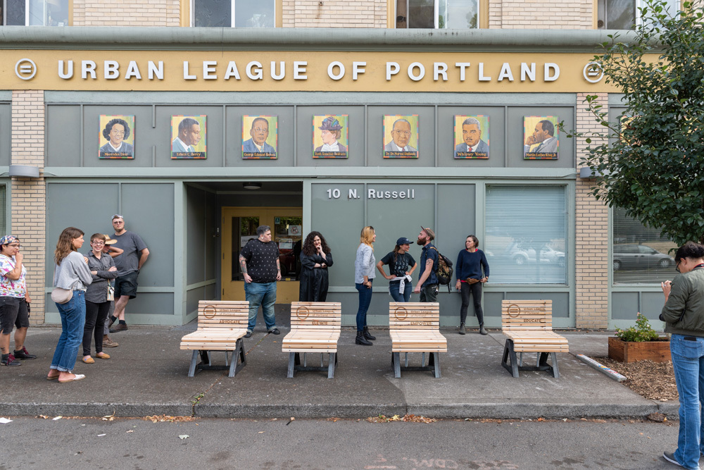 Individual park benches outside of the Urban League of Portland