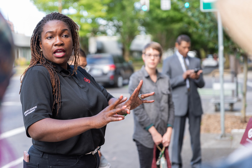 A woman speaking outside of the Urban League of Portland