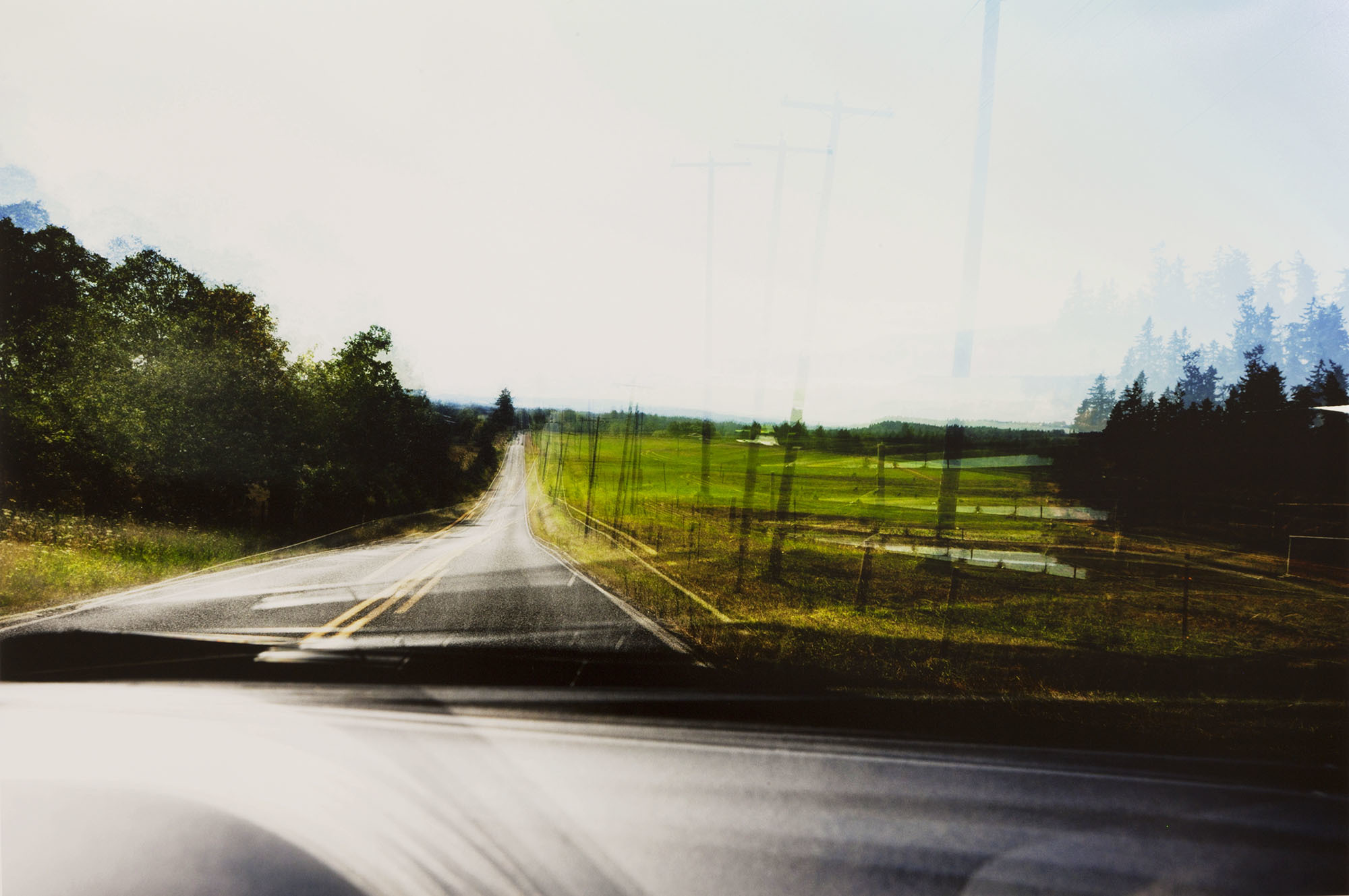 Photo of driver's window scene with grain and repeated exposures 