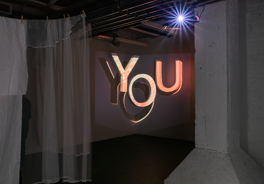 Ali Ongaro artwork featuring an installation of the word 'you'