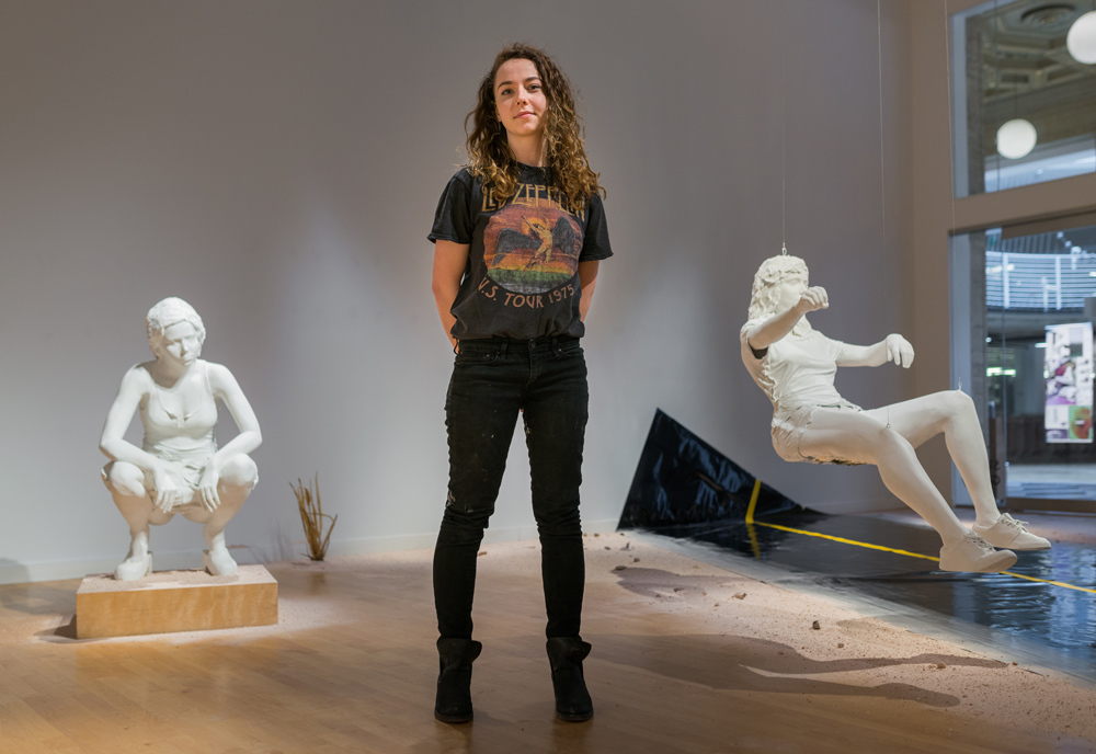 Student Katie Sifford with her life-sized thesis sculptures at Pacific Northwest College of Art (PNCA).