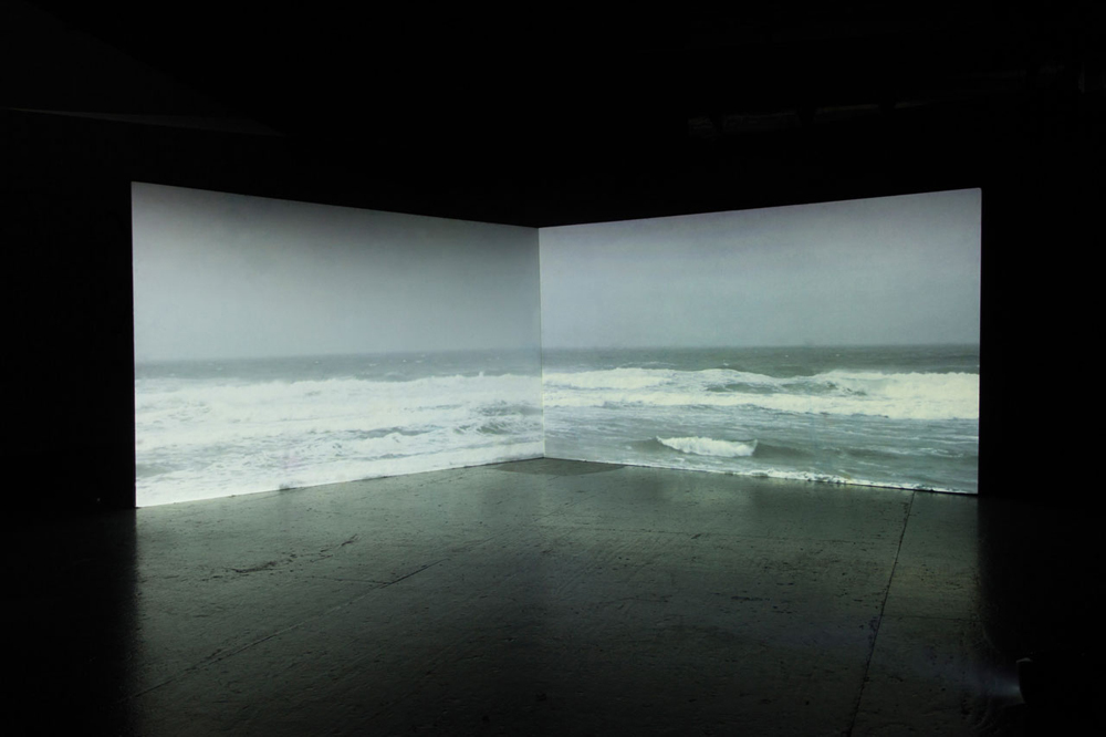 An installation of two panels that showcase ocean waves