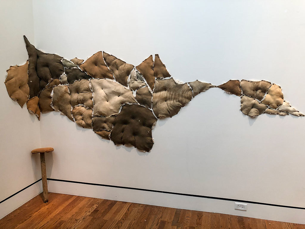 soft sculpture on the wall at Portland Art Museum by Nan Curtis